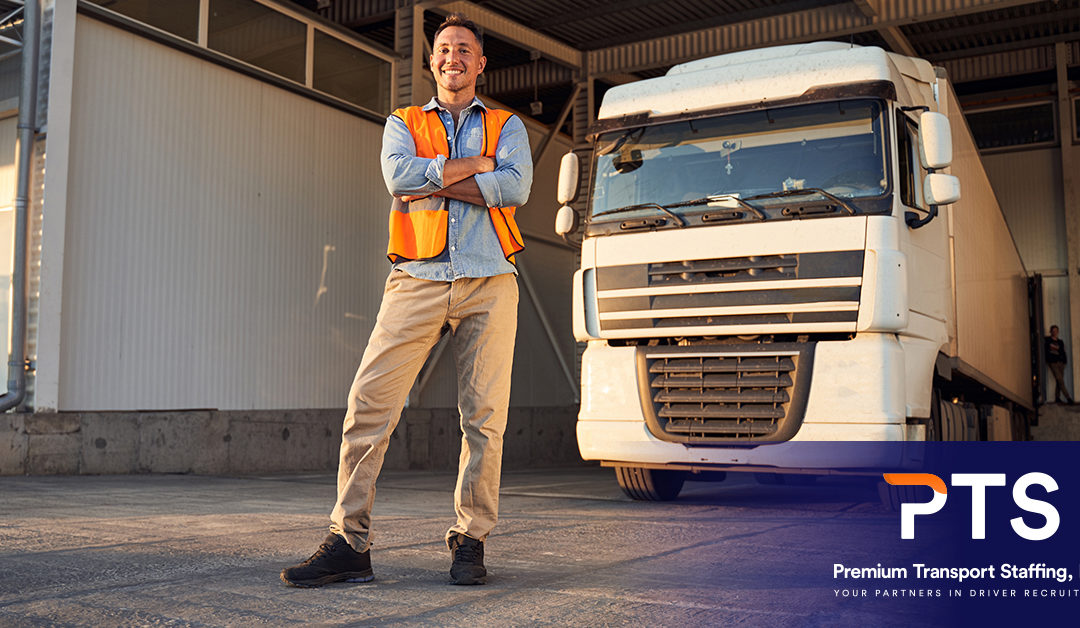 Fleet manager standing in front of a commercial truck